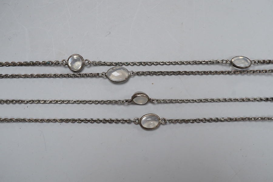 A silver and moonstone longchain necklace, set with cabochon moonstones, connected by a fine link chain, length 128cm, Condition: overall good condition, attractive moonstones and nice design. Silver with typical tarnish